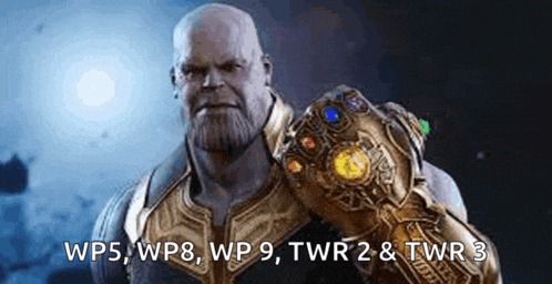 thanos from avengers infinity war is holding a infinity gauntlet in his hand .