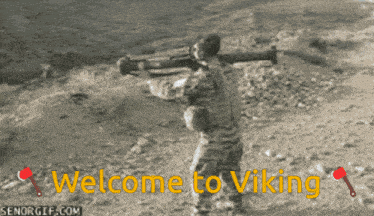a welcome to viking sign with an axe and a shovel