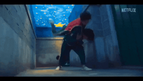 a man is carrying another man on his back in a netflix video .