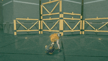 a video game character is standing in front of a wall with the letter m written on it