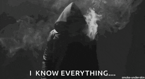 a person in a hooded jacket is smoking a cigarette and says i know everything