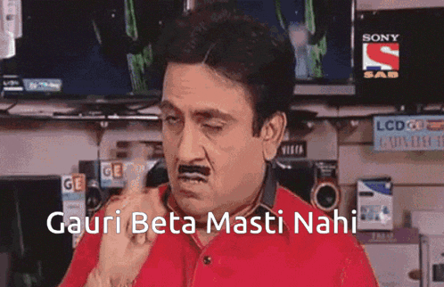 a man with a mustache is making a funny face with the words " gauri beta masti nahi " written below him