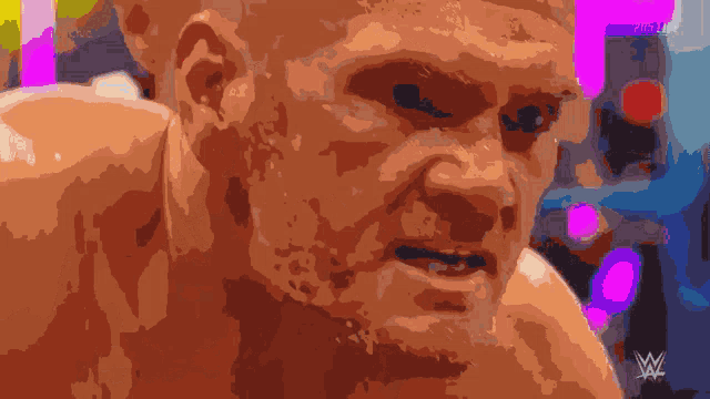 a close up of a man 's face with the words wwe live behind him