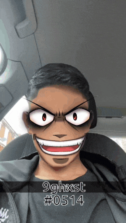 a man in a car with a cartoon face and the name 9ghxst