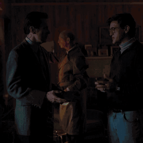 two men are standing next to each other and the words top secret are displayed