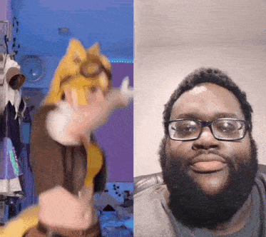 a man with glasses and a beard is wearing a cat costume