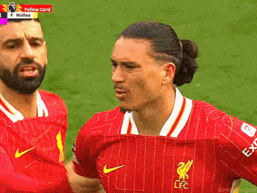 a soccer player wearing a red jersey with the letters lfc on the front