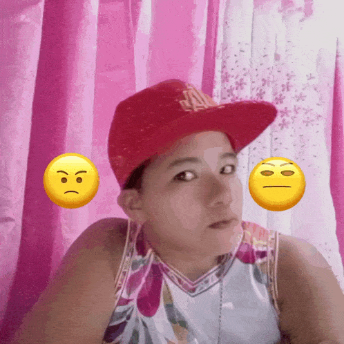 a girl wearing a red hat with a a on it
