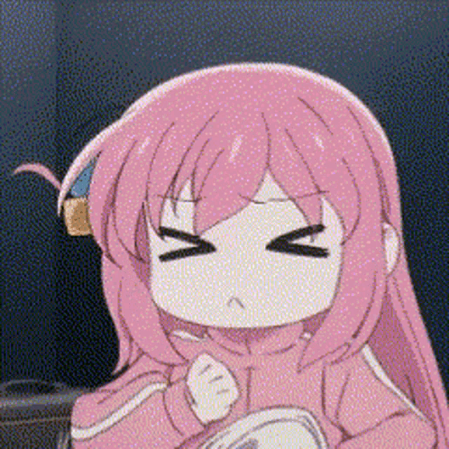 a girl with pink hair is making a funny face with her eyes closed and a pink jacket on .