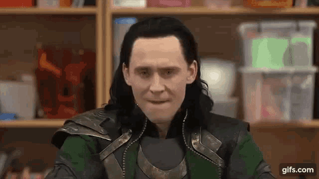 a close up of a man in a loki costume making a funny face .