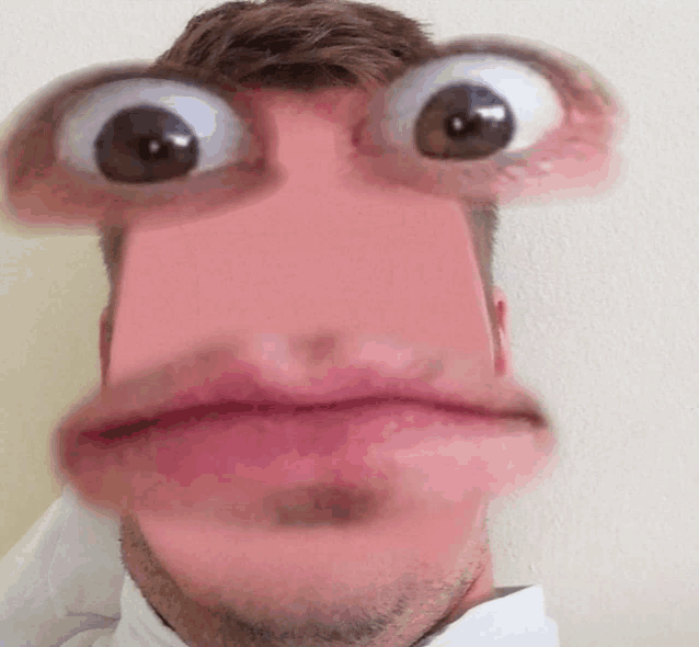 a close up of a man 's face with a funny face