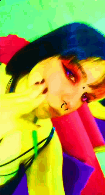 a woman with a piercing in her nose is wearing a blue beanie