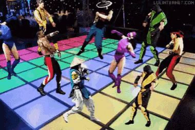 a group of people are dancing on a colorful dance floor with the website luluinternet.com in the corner