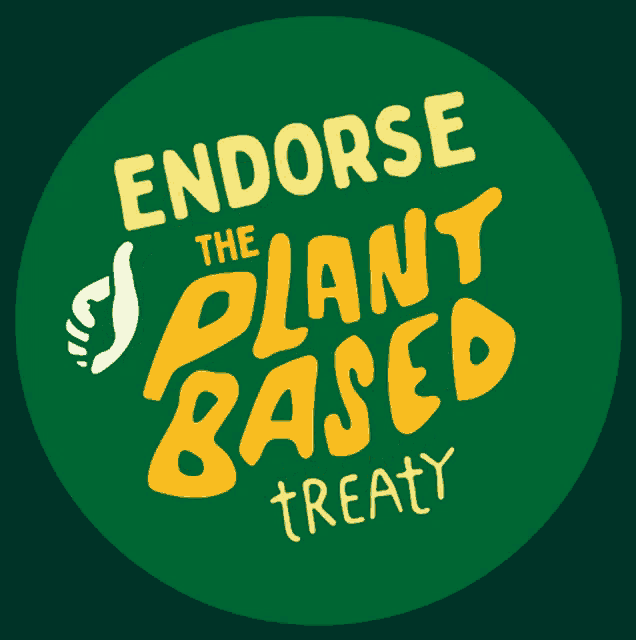 a green sign that says endorse the plant based treaty on it