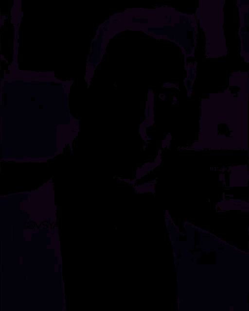 a blurry picture of a man standing in the dark