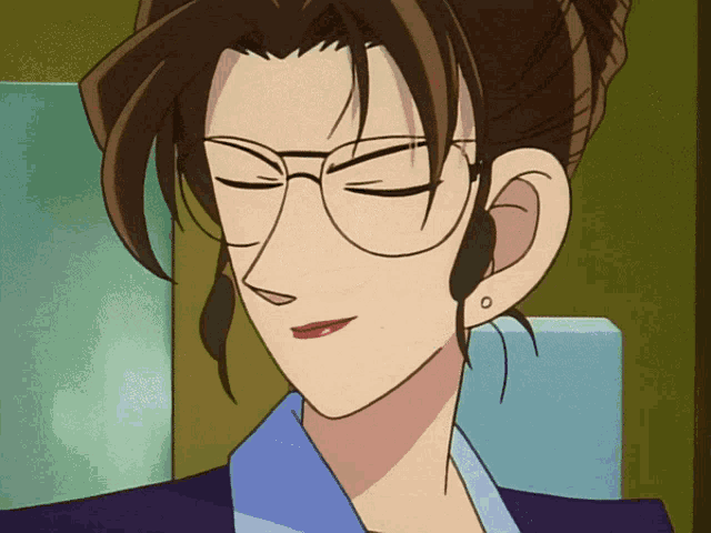 a close up of a woman 's face with glasses and earrings
