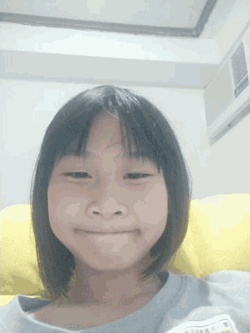 a girl with a name tag that says ' a ' on it smiles for the camera