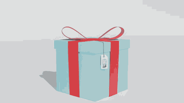 a cat is coming out of a gift box