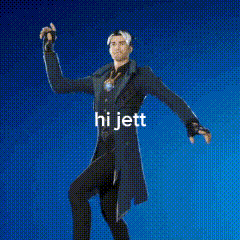 a man in a tuxedo is standing in front of a blue background with the words `` hi jett '' written on it .