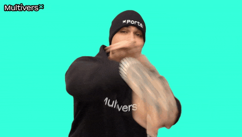 a man wearing a beanie that says portal gives a thumbs up