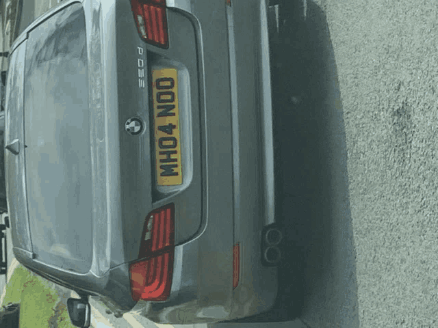 a bmw with a license plate that says who4noo