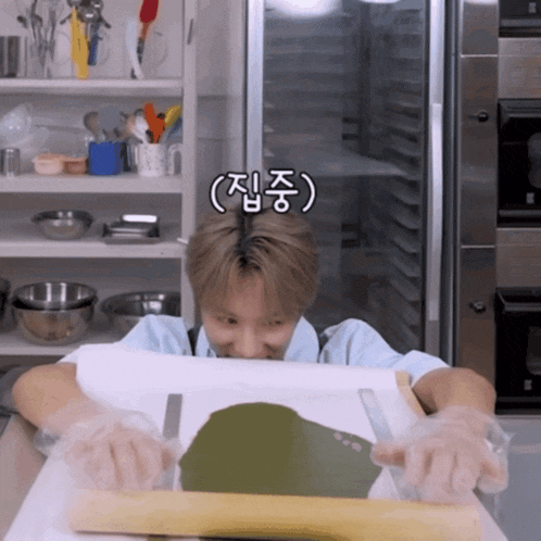 a person is rolling out a piece of dough with a rolling pin