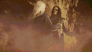 two women standing next to each other in a foggy area