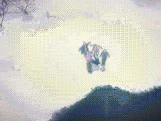 a group of people are flying through a cloudy sky above a mountain