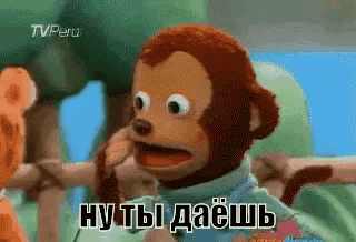 a stuffed monkey with a tv peru logo on the bottom right