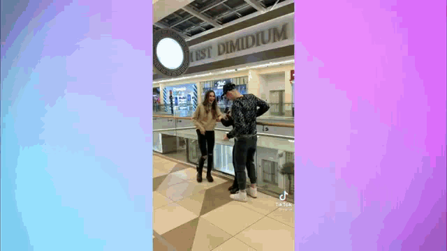 a man and two girls are standing next to each other in a mall .