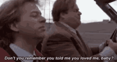 two men are sitting in a car and one of them is asking the other if he remembers what he told him .