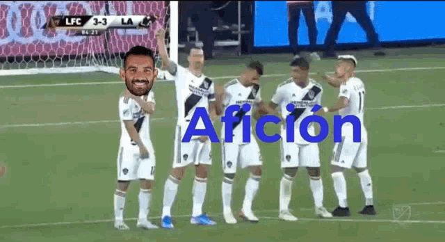 a group of soccer players are standing on a field with the word afcion in blue letters
