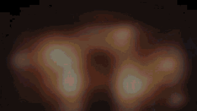 a blurred image of a person standing in the dark
