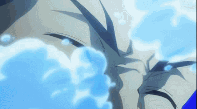a close up of a person 's face with water coming out of his mouth