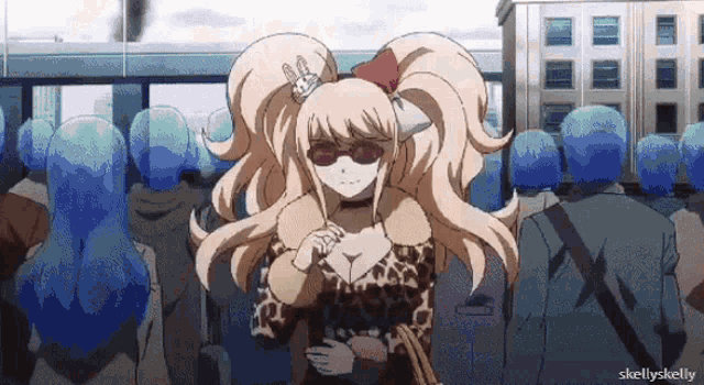 a girl with a crown on her head is standing in front of a crowd of people .