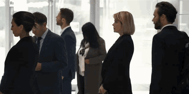 a group of people standing next to each other with the letters rt on the bottom