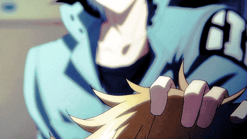 a close up of a person wearing a blue jacket with the letter a on the sleeve