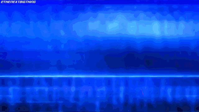 a blurry picture of a person in a blue light with the words " the next big thing " on the bottom right