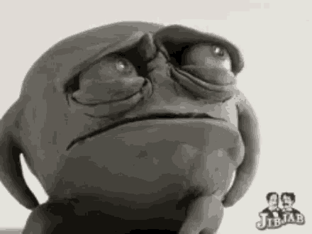 a black and white photo of a cartoon character with a sad look on his face