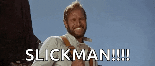a man with a beard is smiling with the words slickman written below him