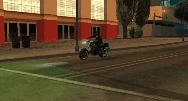 a person riding a motorcycle down a street with a building in the background