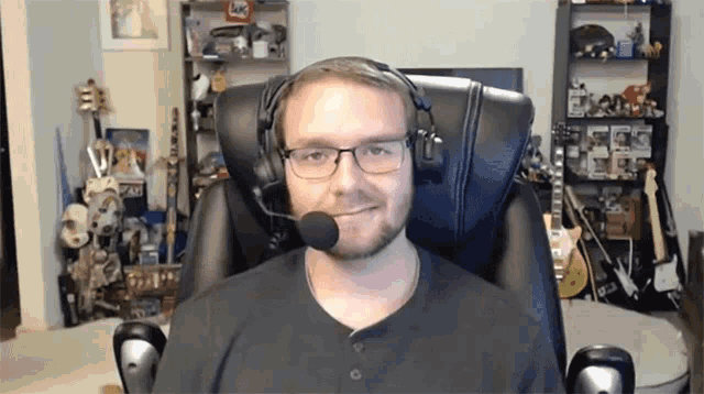 a man wearing glasses and headphones with a microphone