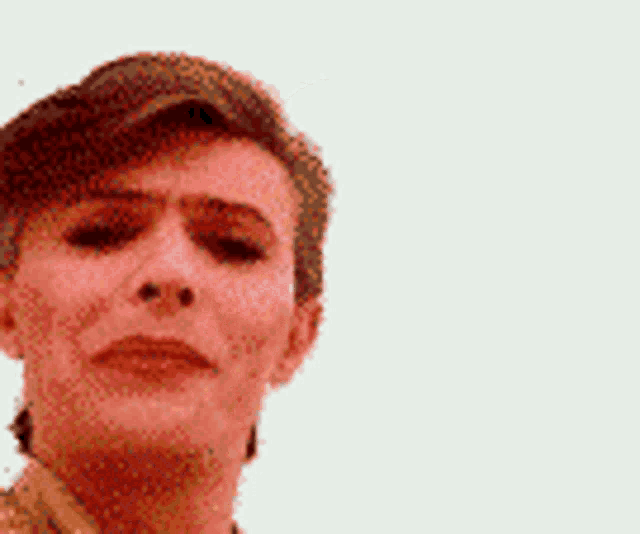 a close up of a person 's face with a blurred background