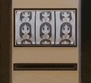 a vending machine with a picture of a girl on it is sitting on a wall .