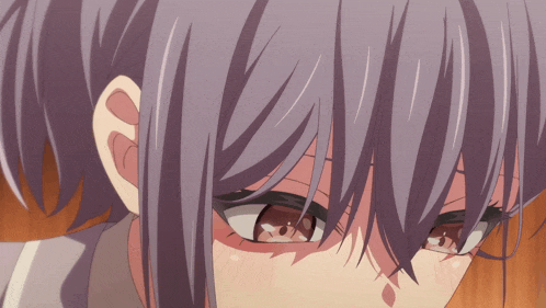 a close up of a woman 's face with purple hair