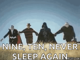 a group of people holding hands in a field with the words " nine , ten , never sleep again " on the bottom