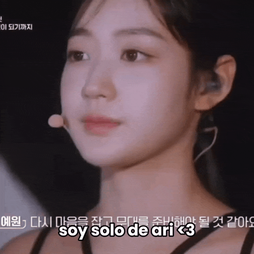 a close up of a woman 's face with the words soy solo de ari written below her