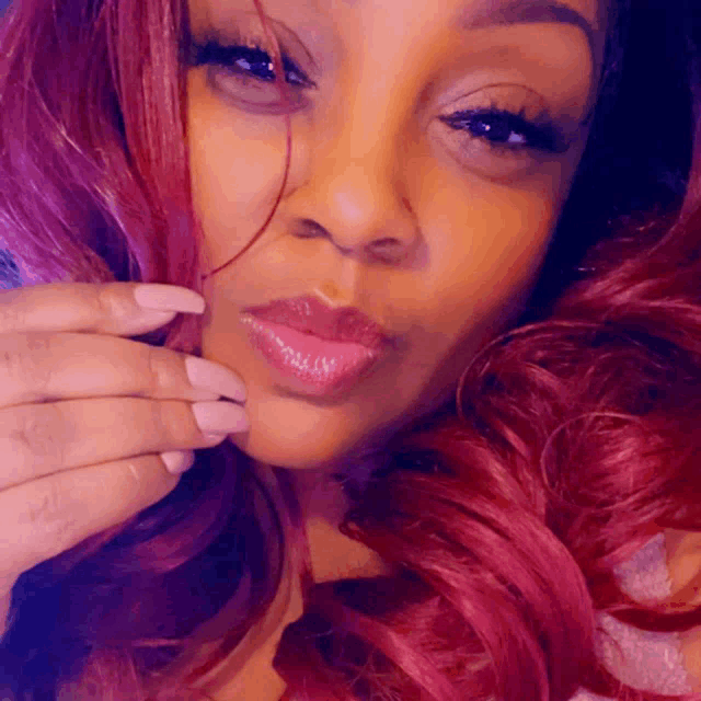 a close up of a woman with red hair