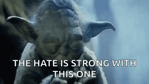 yoda from star wars is smoking a cigarette with the words `` the hate is strong with this one '' .