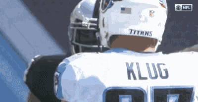 a football player named klug is wearing a titans helmet .